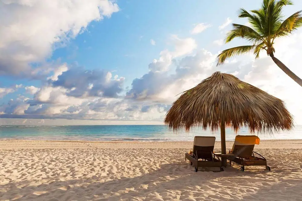 Beach umbrella and sun loungers at Playa Palmera Beach Resort 